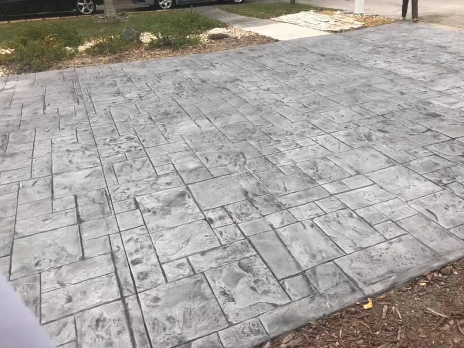 Charcoal stamped concrete patio in a stone pattern