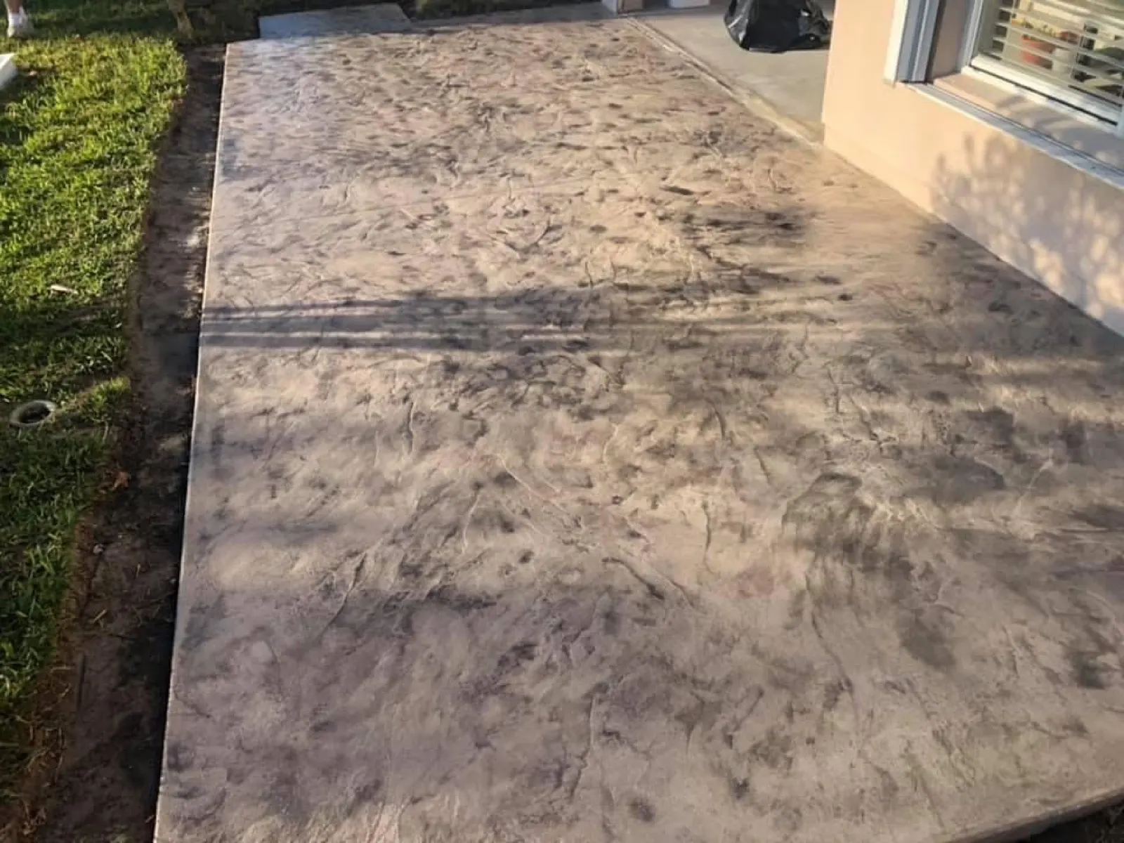 Paver pool deck around a pool and spa