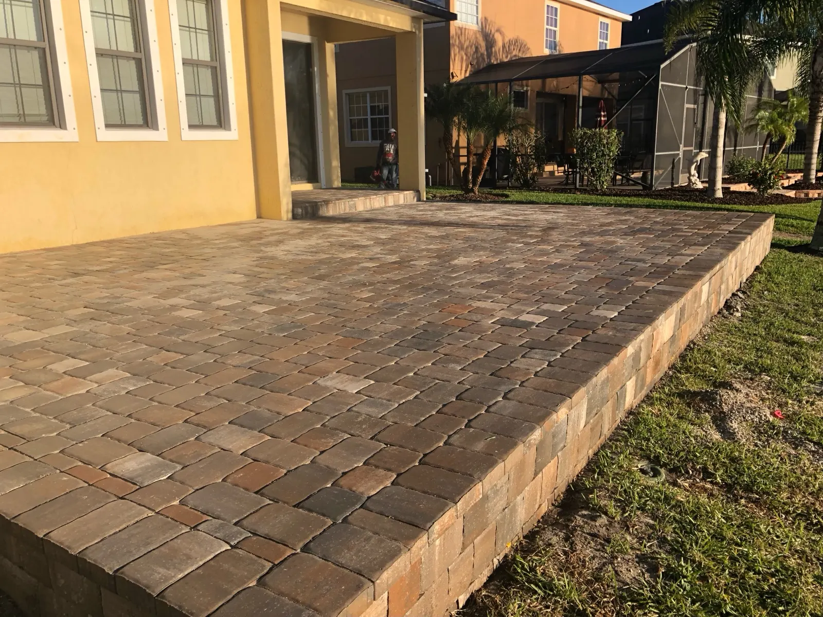 Raised paver patio with a seat wall edge