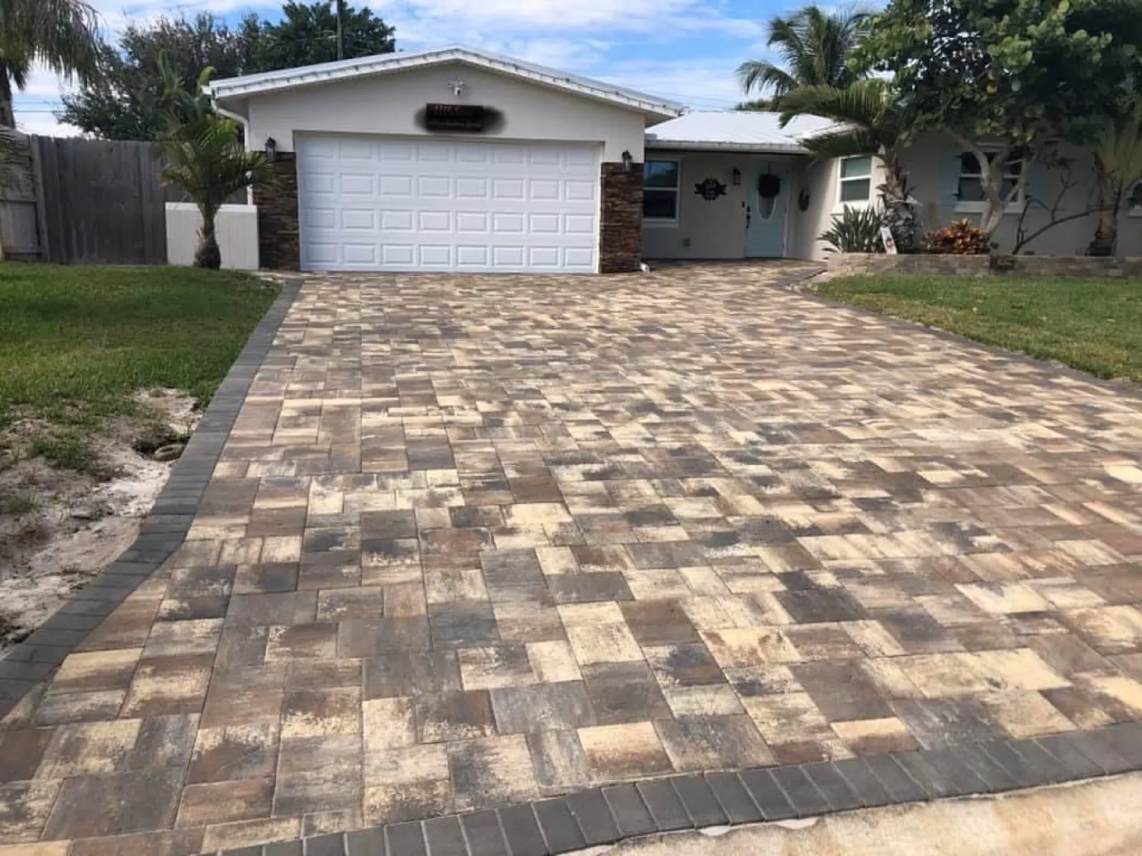 Fresh stamped concrete patio with a circle inlay