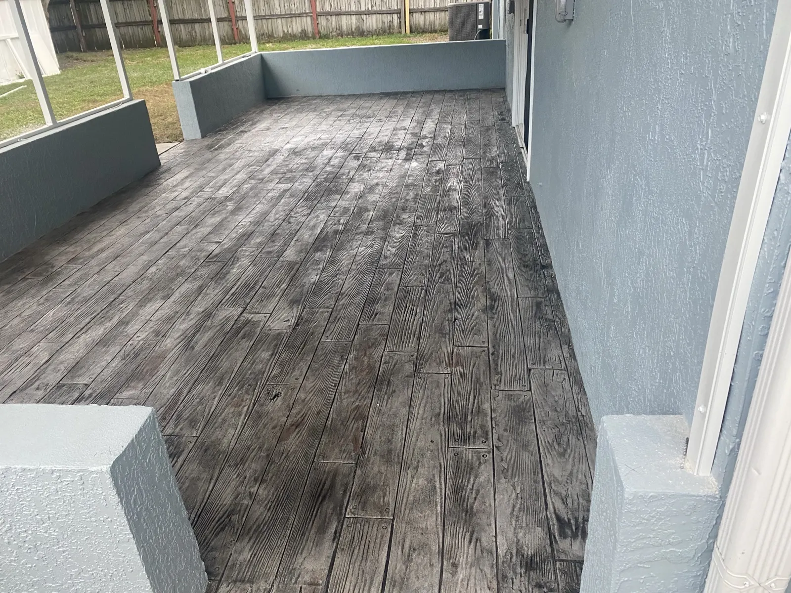 Wood plank pattern stamped concrete porch